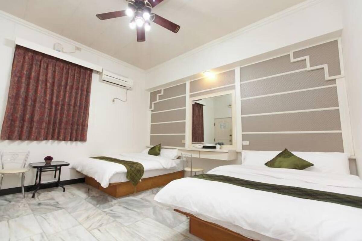 Desk, laptop workspace, blackout curtains, rollaway beds