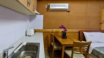 Standard Double Room, Kitchenette | Living area | Flat-screen TV
