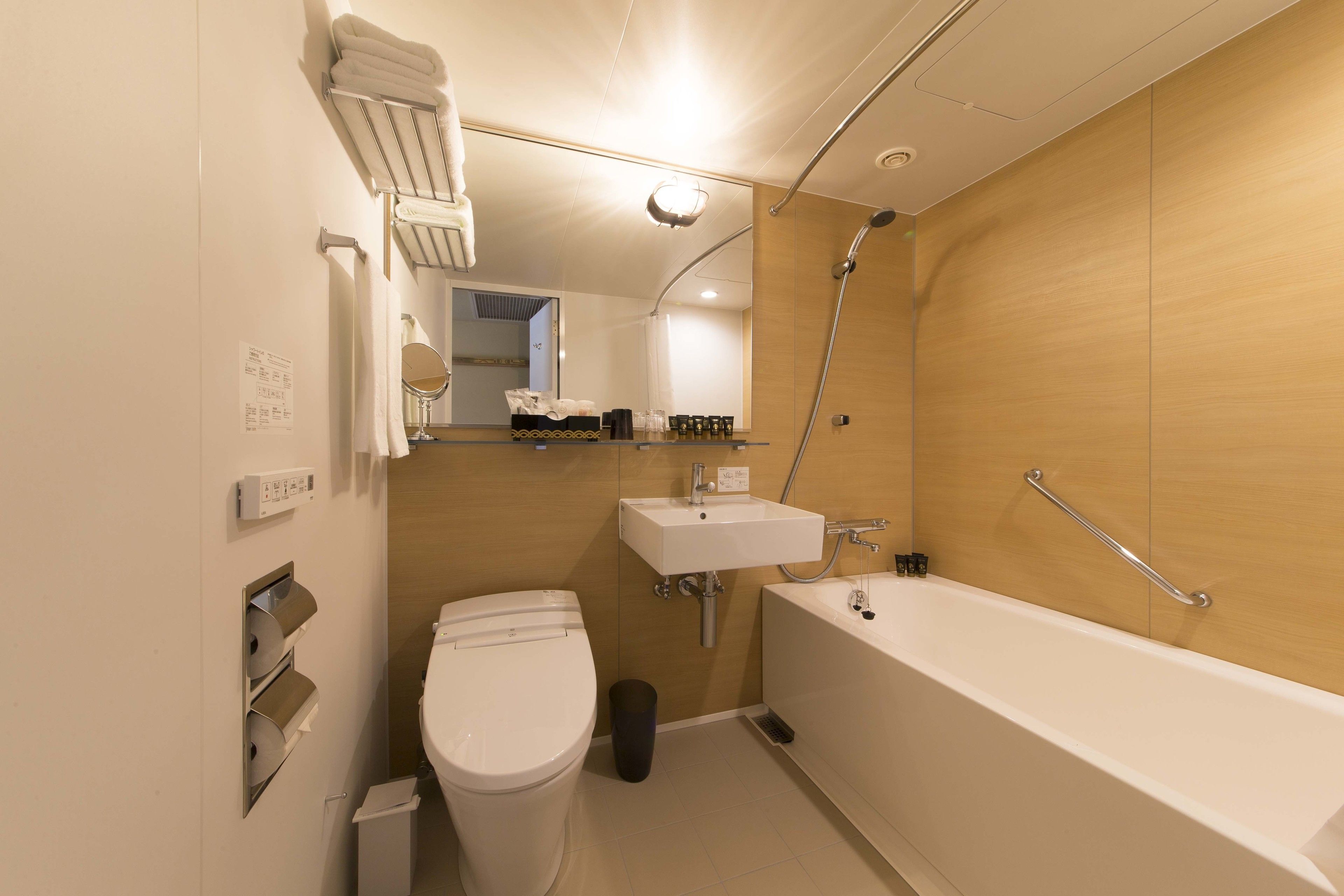 combined shower/bathtub, free toiletries, hair dryer, slippers