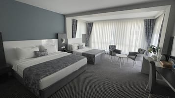 Deluxe Room | Minibar, in-room safe, desk, laptop workspace