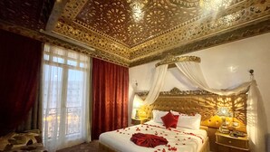 A luxurious bedroom with a large bed, ornate ceiling, and a view through a window. - Royal Victoria - Ex British Embassy (Tunis)