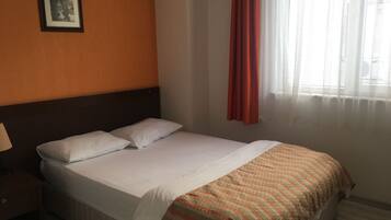 Economy Room | Minibar, desk, free WiFi, bed sheets