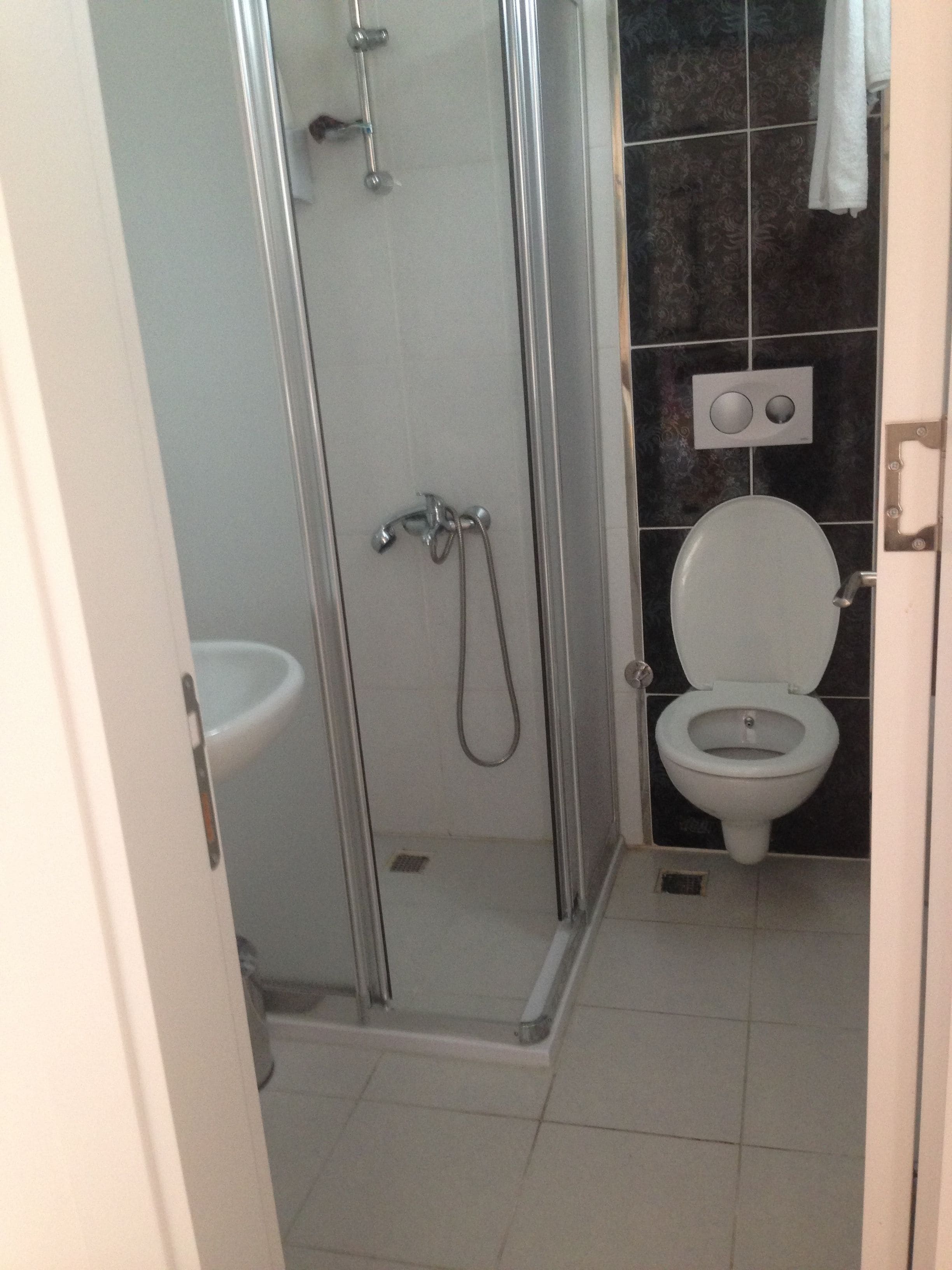 standard room | bathroom | shower, free toiletries, hair dryer, slippers