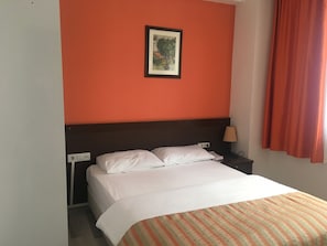 Economy Room | Minibar, desk, free WiFi, bed sheets