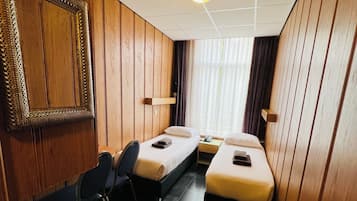 Economy Twin Room, 2 Single Beds | Minibar, in-room safe, iron/ironing board, free WiFi