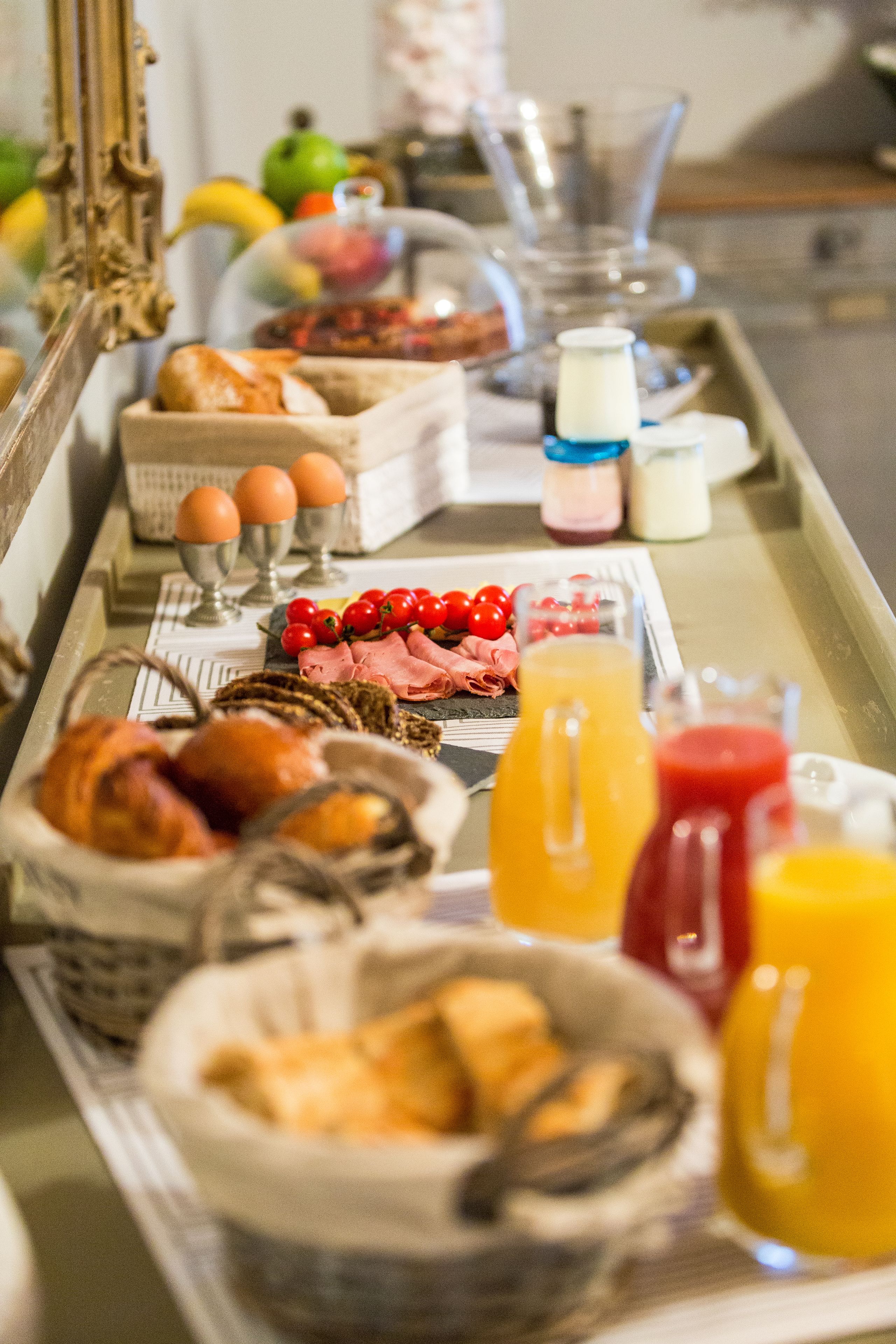 A breakfast buffet with various food items and beverages.