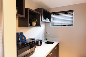 Fridge, microwave, toaster, cookware/dishes/utensils