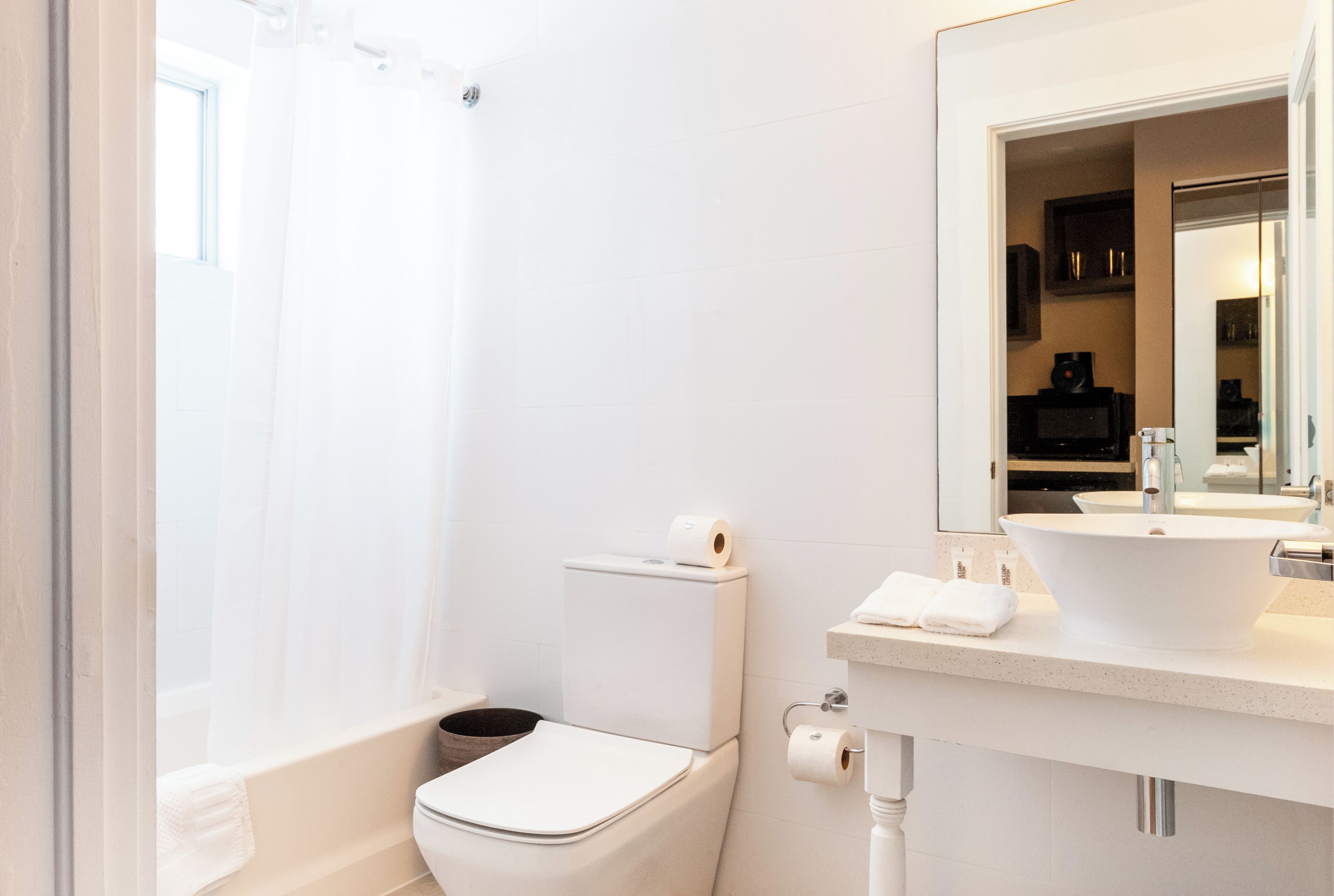 Accessible Studio Double Queen | Bathroom | Combined shower/bathtub, designer toiletries, hair dryer, towels
