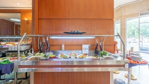 A buffet setup with various dishes and a central display. - Lavender Hotel Sharjah (Sharjah)