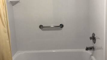 Combined shower/bathtub, designer toiletries, hair dryer, towels
