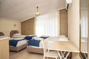 Standard Quadruple Room, 1 Bedroom | Minibar, desk, soundproofing, free WiFi