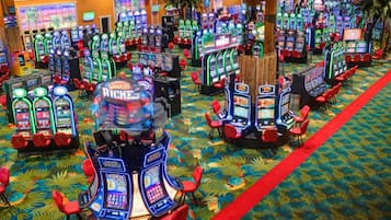 Experience the excitement of gaming on our spacious casino floor, where rows of machines offer endless entertainment options.