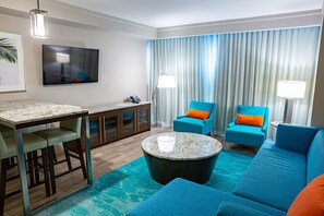 Signature Suite, 1 King Bed | Living area | Flat-screen TV, pay films