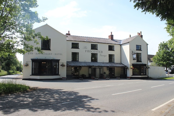 A two-story building with a sign reading "The Frocester George Bar, Restaurant, Hotel". - The Frocester (Stonehouse)