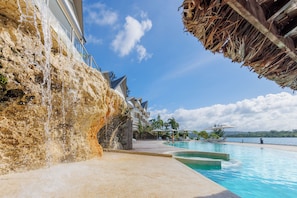 Outdoor pool, pool umbrellas, sun loungers