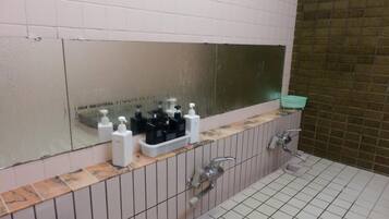 Separate bathtub and shower, towels