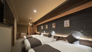 A hotel room with two beds, a desk, and a TV. - Nagoya B's Hotel (Nagoya)