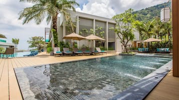 Outdoor pool, open 7:00 AM to 7:00 PM, pool umbrellas, sun loungers