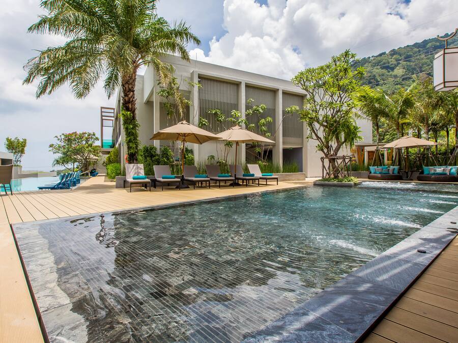 Outdoor pool, open 7:00 AM to 7:00 PM, pool umbrellas, sun loungers