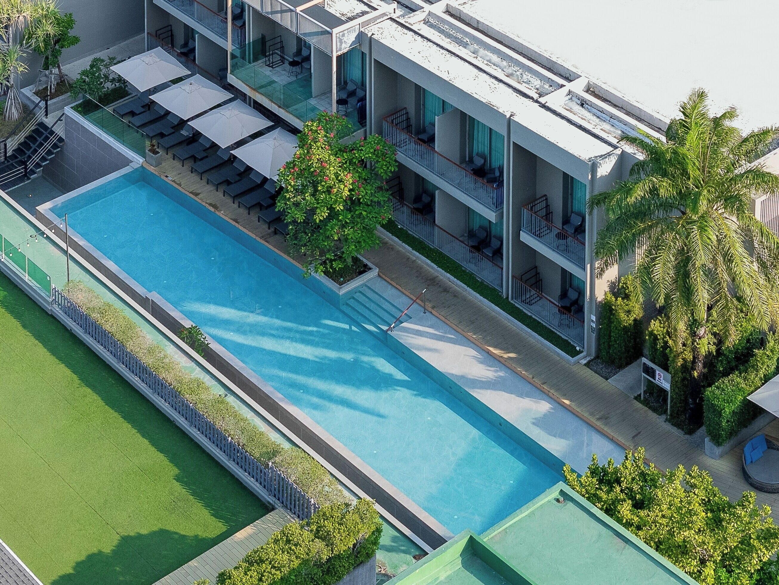 Outdoor pool, open 7:00 AM to 7:00 PM, pool umbrellas, pool loungers