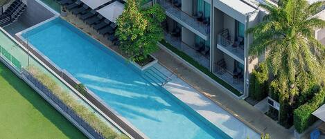 Outdoor pool, open 7:00 AM to 7:00 PM, pool umbrellas, sun loungers