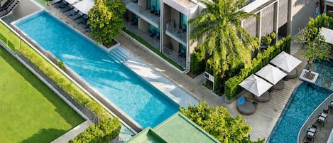 Outdoor pool, open 7:00 AM to 7:00 PM, pool umbrellas, pool loungers