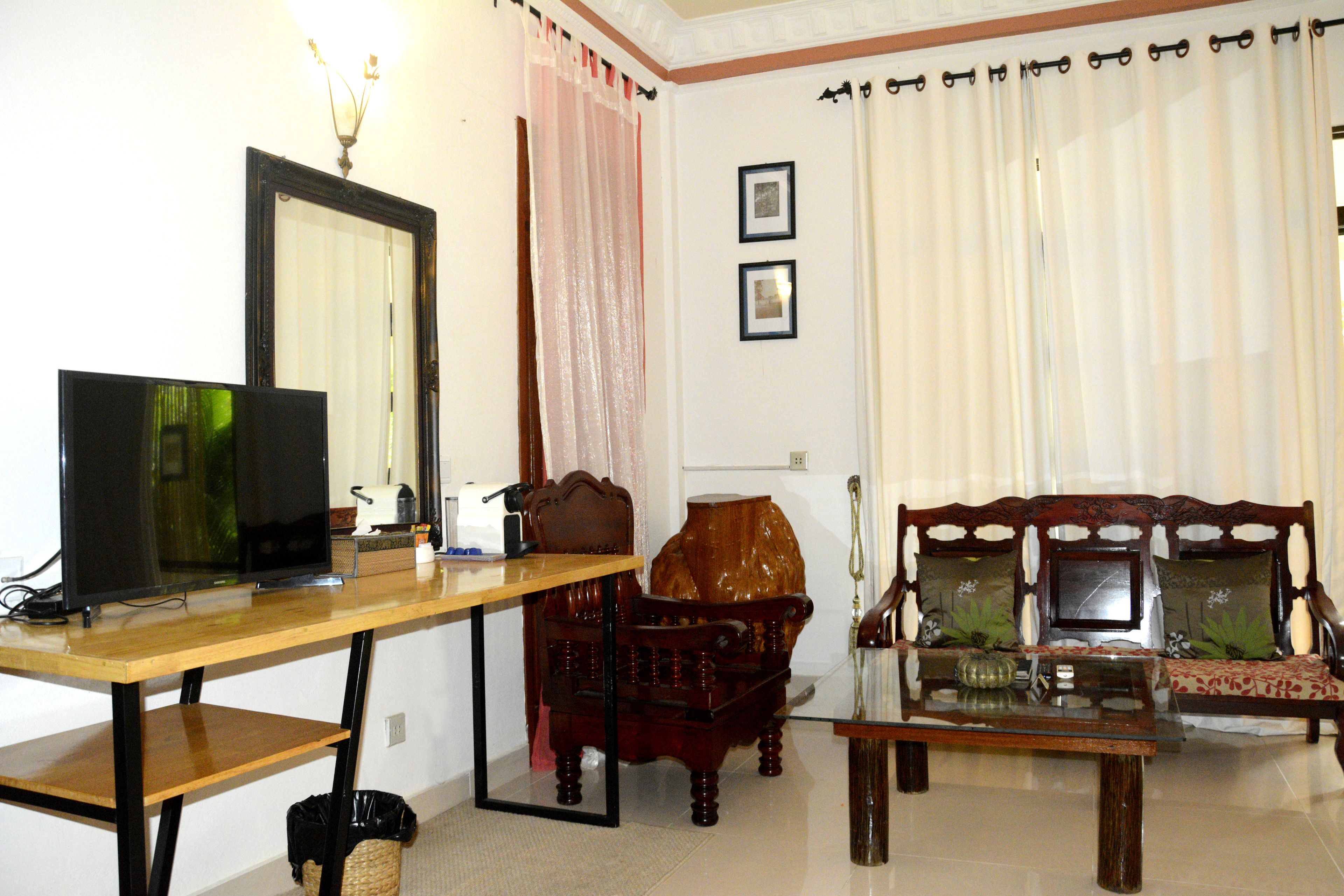 grand suite, 1 bedroom, garden view | minibar, in-room safe, desk, iron/ironing board