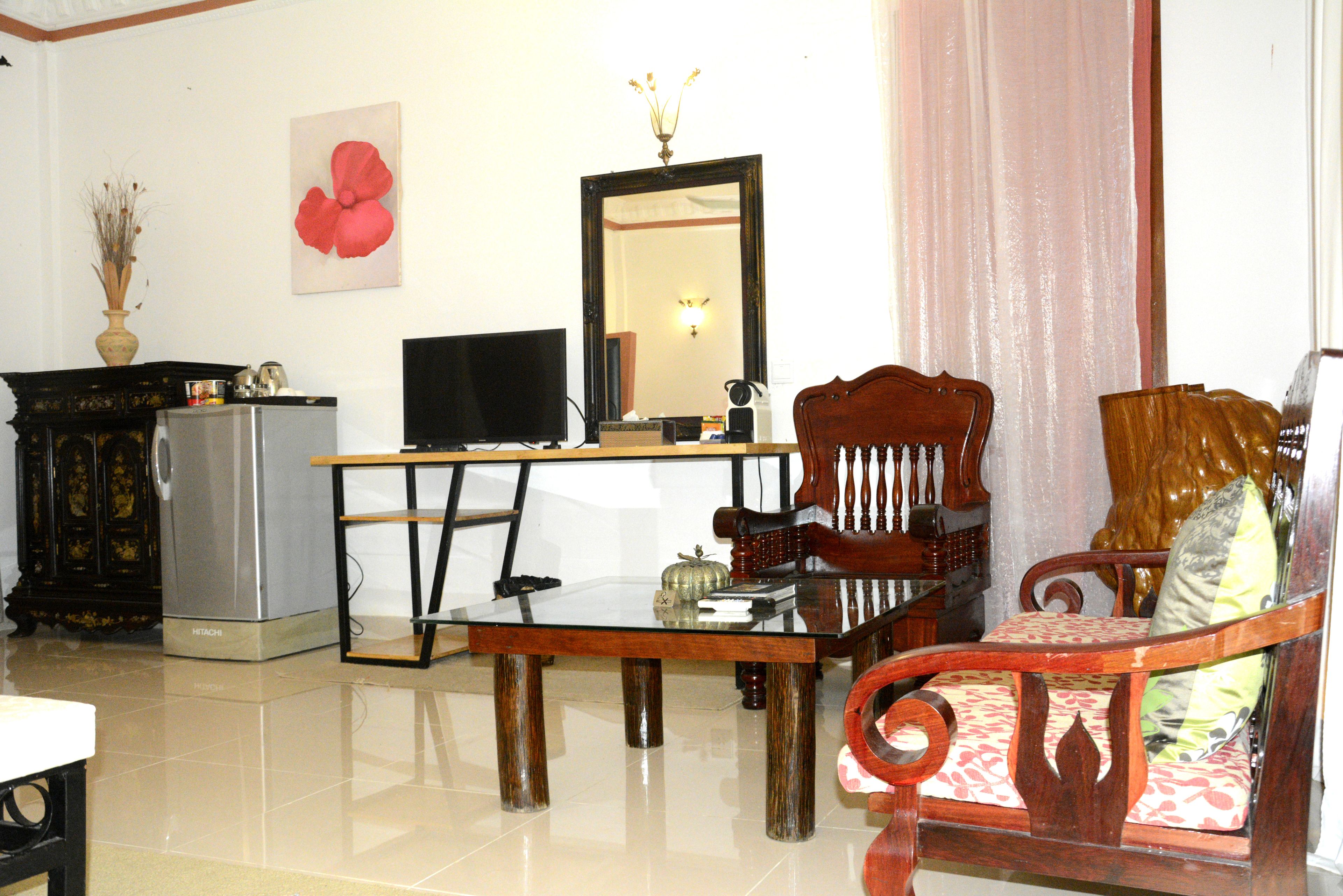 grand suite, 1 bedroom, garden view | minibar, in-room safe, desk, iron/ironing board
