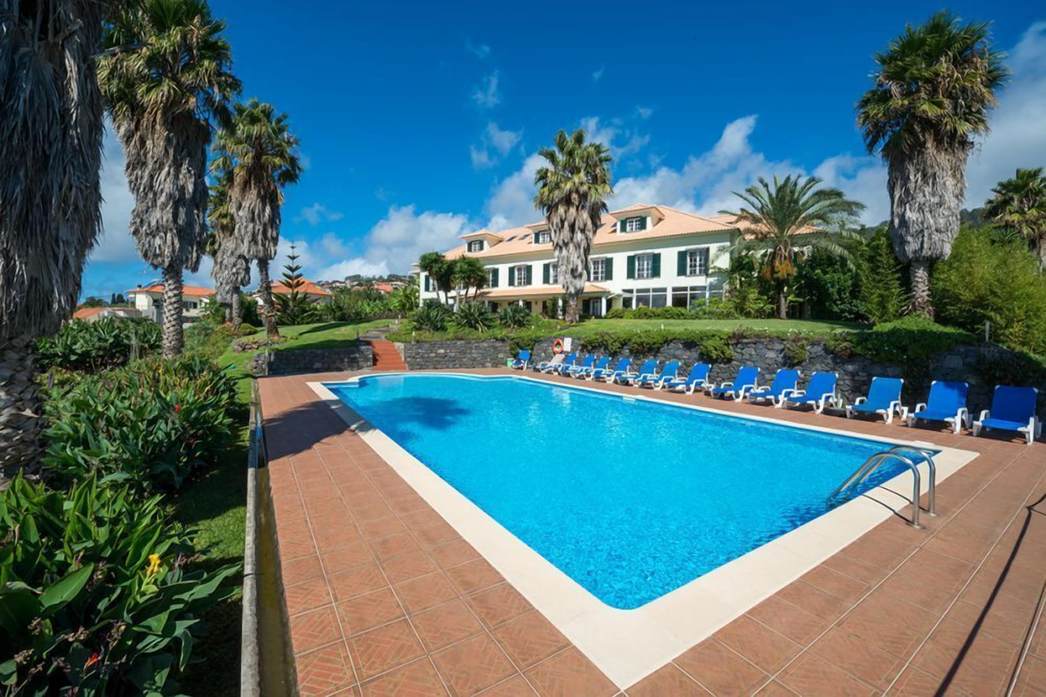 outdoor pool, pool umbrellas, pool loungers