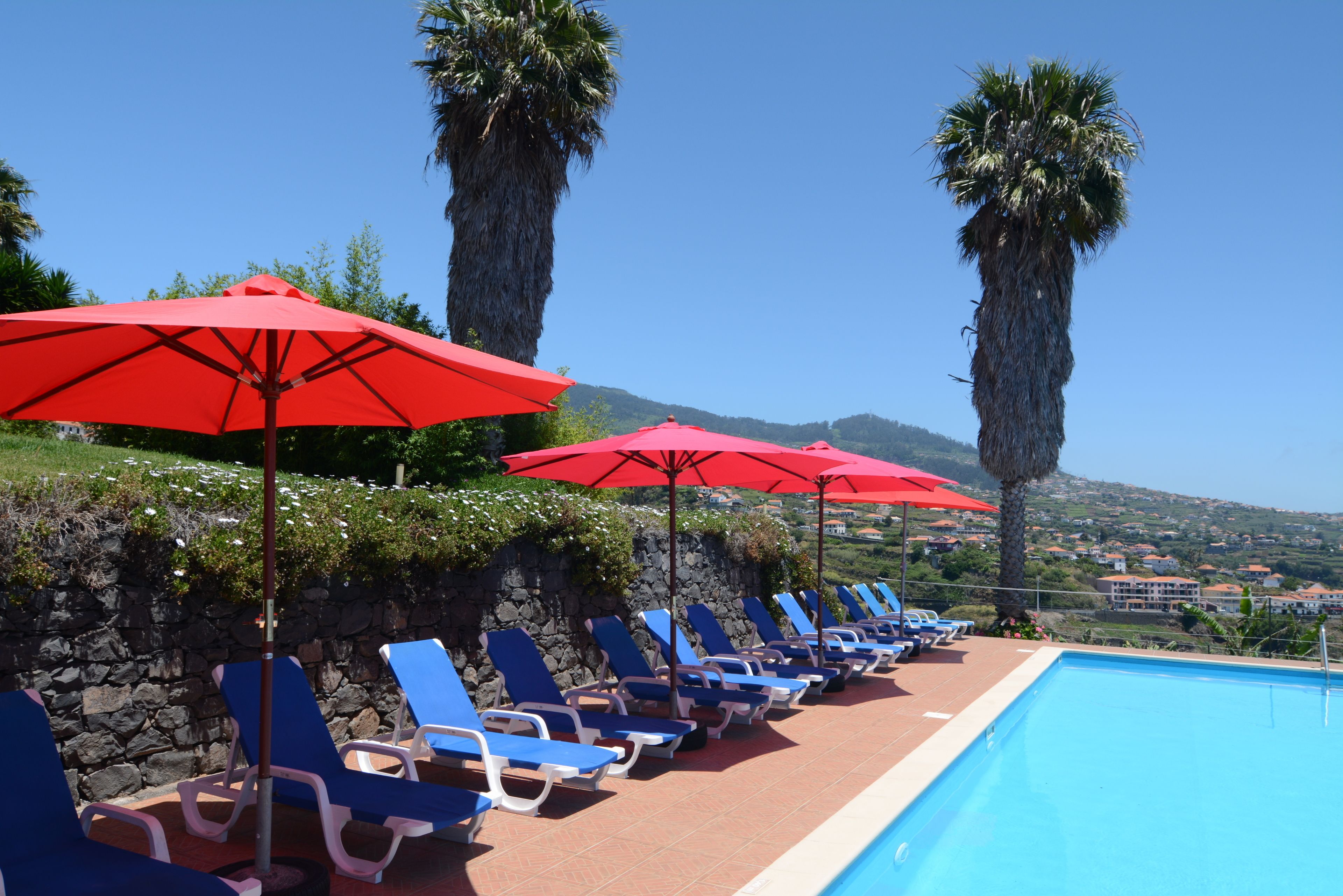 outdoor pool, pool umbrellas, pool loungers