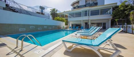 Outdoor pool, pool umbrellas, sun loungers