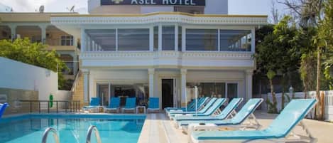 Outdoor pool, pool umbrellas, pool loungers