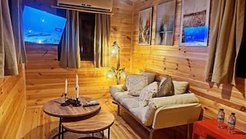 Casa de árbol de diseñador | Área de sala de estar