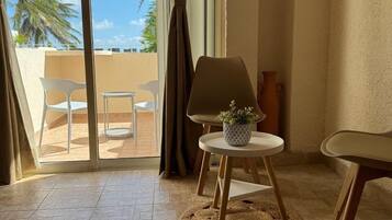 Deluxe Room, Partial Sea View | Living area | Smart TV
