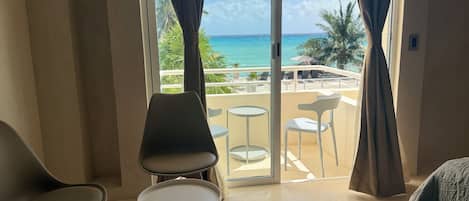 Deluxe Double Room, Partial Sea View | 1 bedroom, in-room safe, blackout drapes, iron/ironing board