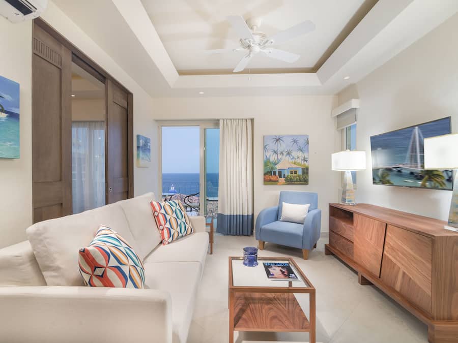Luxury Suite, 1 Bedroom, Kitchen, Ocean View | Living area | 48-inch flat-screen TV with cable channels, TV