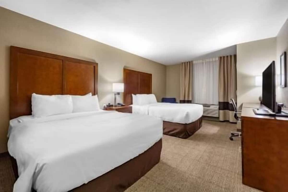 Pillow-top beds, desk, laptop workspace, blackout curtains