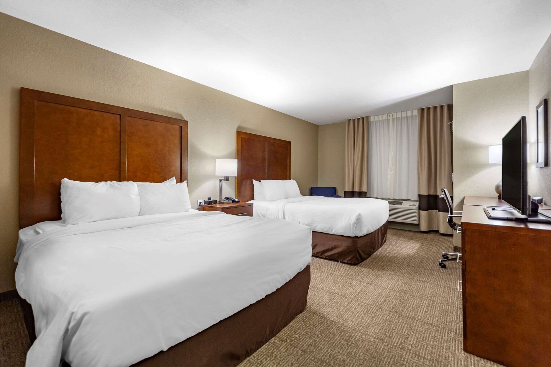 Pillow-top beds, desk, laptop workspace, blackout curtains