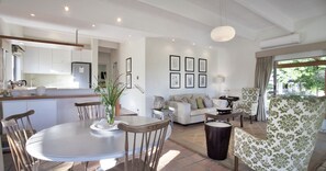 Olive Cottage 1 | Living area | 52-inch Smart TV with satellite channels, TV - Klein Welmoed Luxury Guest House (Stellenbosch)