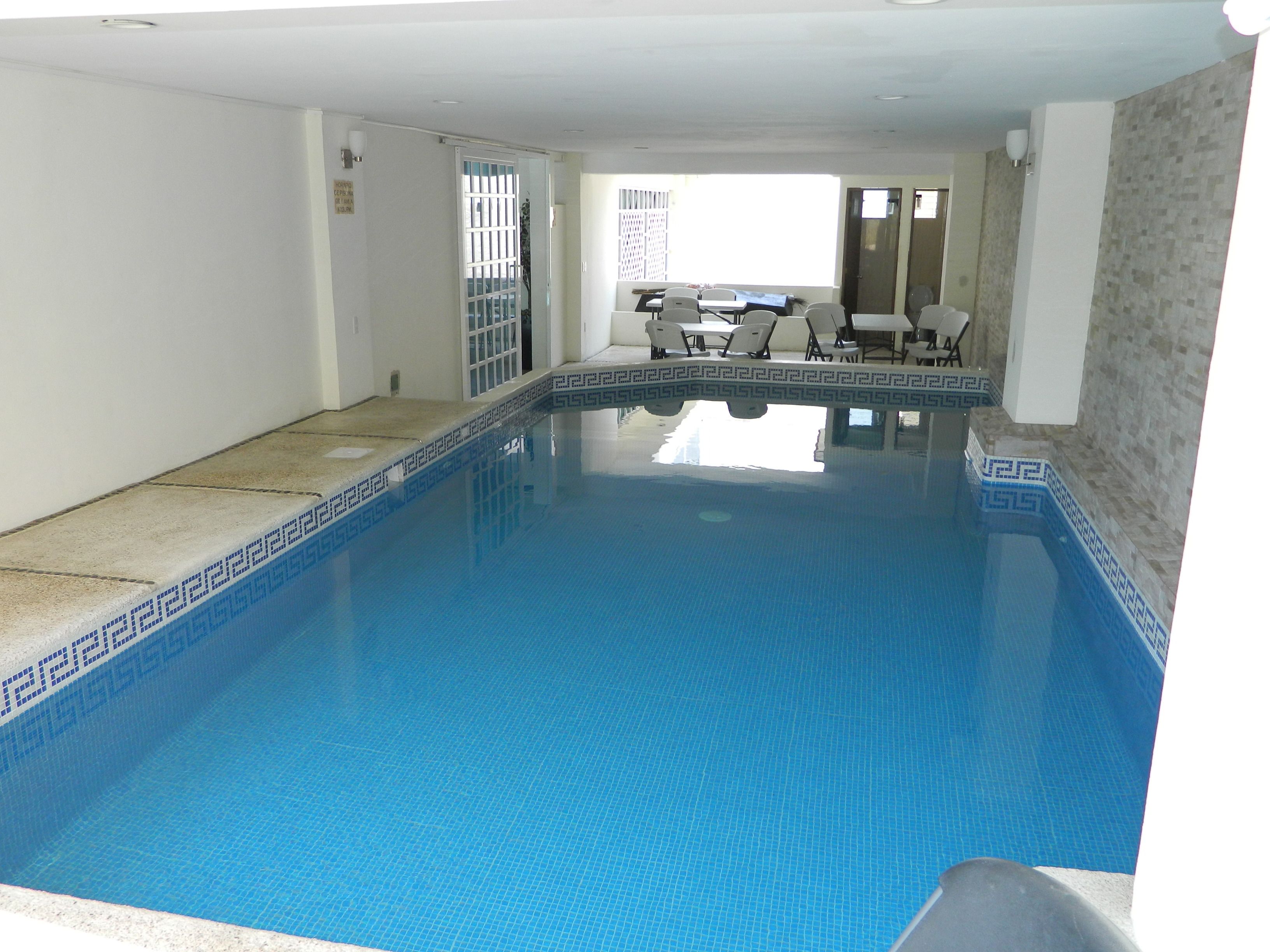 Indoor pool, sun loungers
