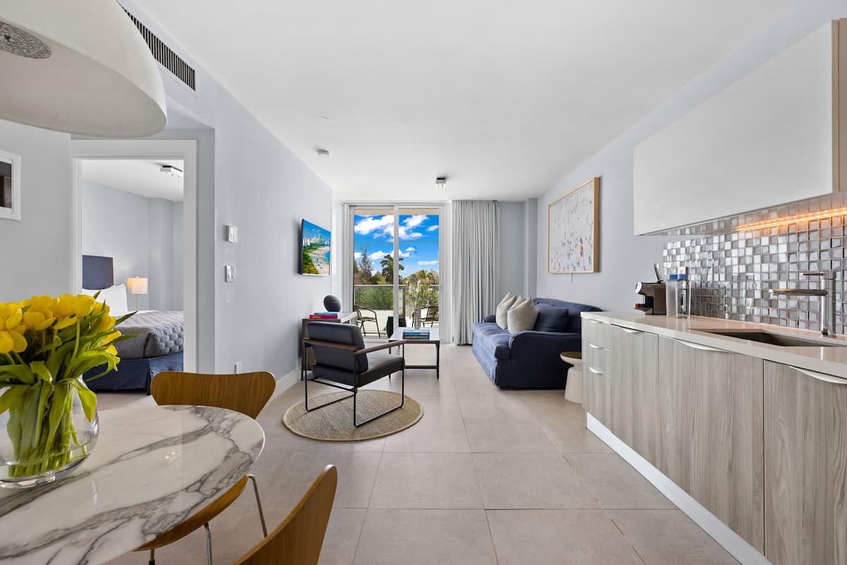 Signature Room, 1 King Bed with Sofa bed | Living area | 45-inch flat-screen TV with cable channels, TV, iPad