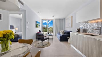 Signature King, One Bedroom Suite | Living area | 45-inch flat-screen TV with cable channels, TV, iPad