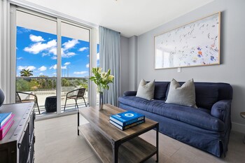 Signature King, One Bedroom Suite | Living area | 45-inch flat-screen TV with cable channels, TV, iPad at ABAE Hotel by Eskape Collection 