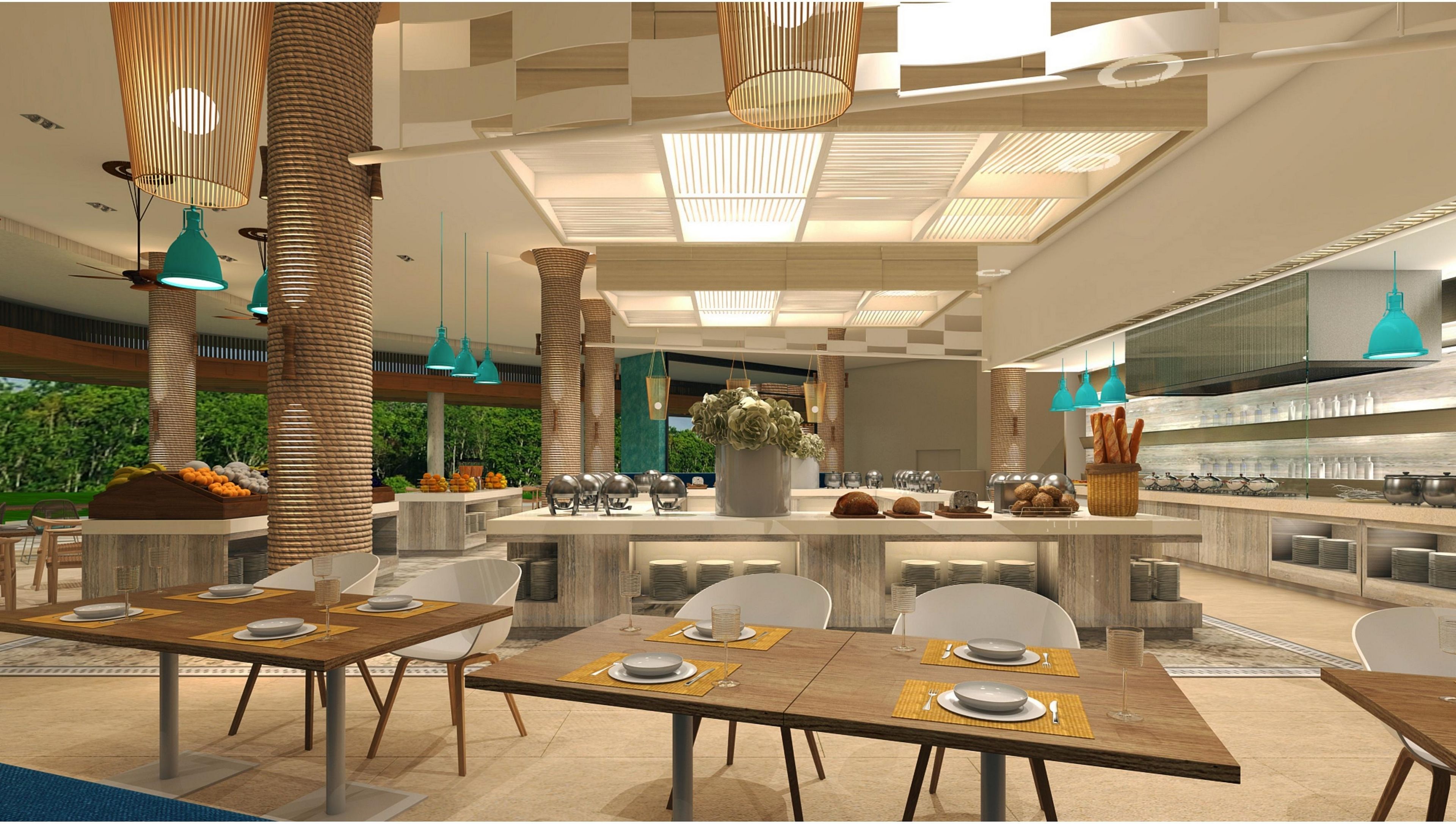 A modern dining area with high ceilings, pendant lighting, and a central island with a floral arrangement.