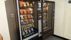 A vending machine with various snacks and drinks.
