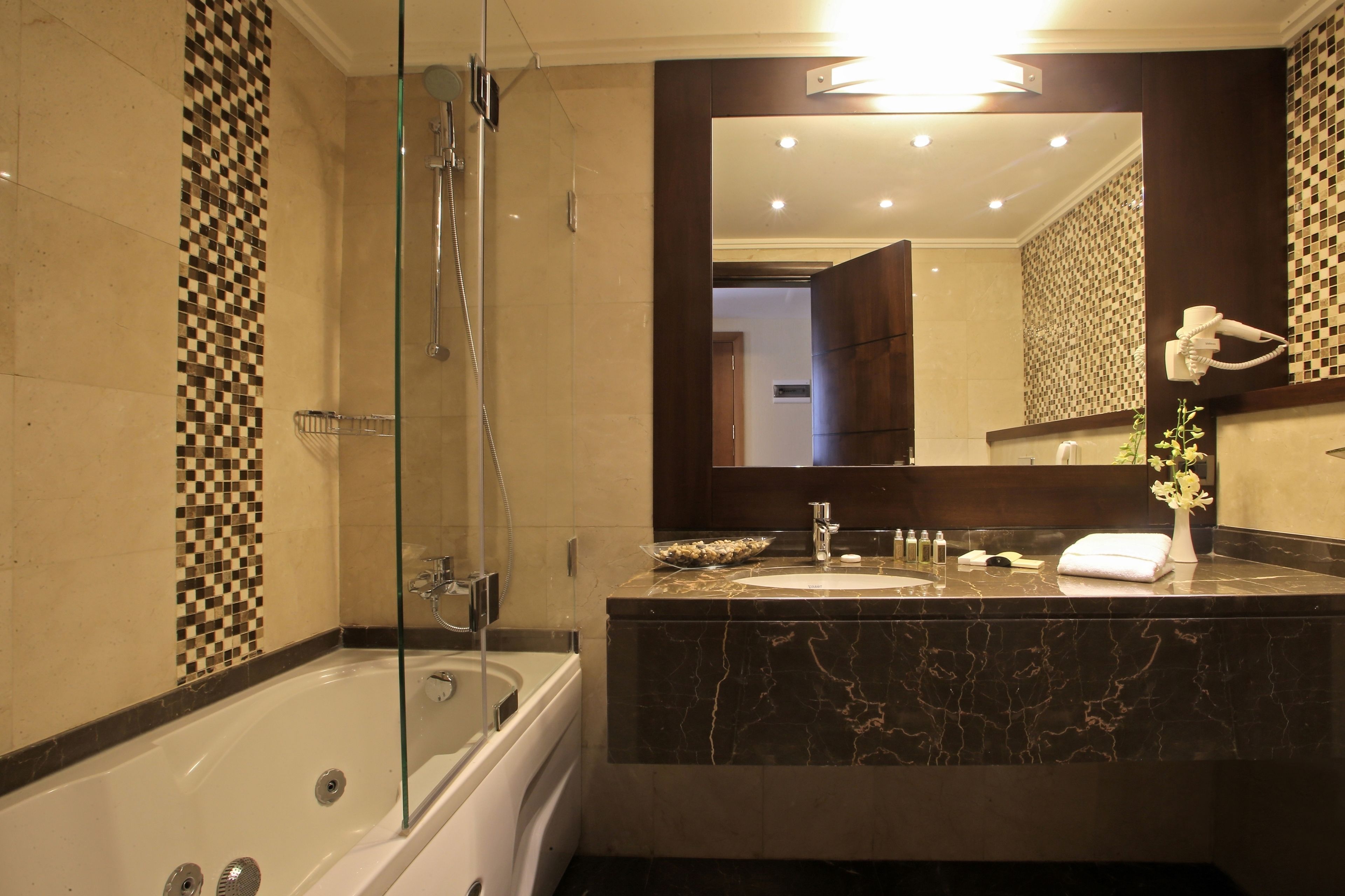 deep-soaking bathtub, free toiletries, hair dryer, bathrobes