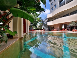 Seasonal outdoor pool, open 10:00 AM to 7:00 PM, sun loungers