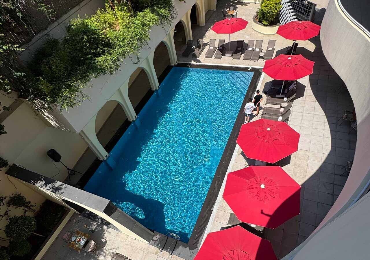 Seasonal outdoor pool, open 10:00 AM to 7:00 PM, sun loungers