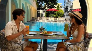 Seasonal outdoor pool, open 10:00 AM to 7:00 PM, sun loungers