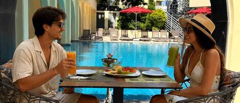 Seasonal outdoor pool, open 10:00 AM to 7:00 PM, sun loungers